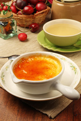 Delicious french dessert creme brulee  on the table