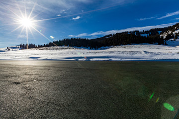   The frozen Sailimu lake with snow mountain background at Yili, Xinjiang of China