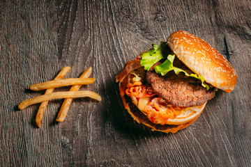 Big Mac hamburger and a salad. The concept of diet and fast food