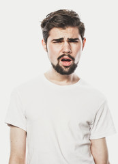 Fototapeta premium Portrait of young amazed man isolated on white background