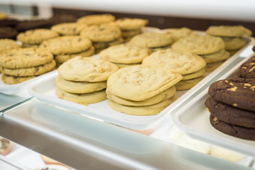 Artisanal cupcakes and cookies at a bakery on display