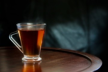 Hot Black Tea In Glass Cup On Wooden Table 