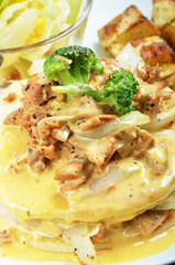 Pancake  in white plate with cream cheese and tuna.