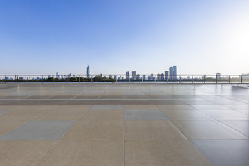 Panoramic skyline and buildings with empty concrete square floor