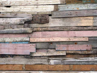 Wall of old multi-colored wooden boards