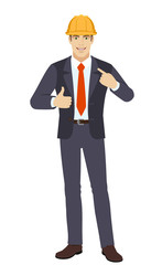 Self promotion. Businessman in construction helmet  pointing the finger at himself and showing thumb up