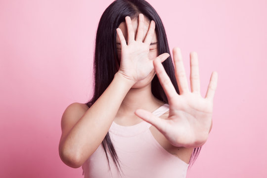 Young Asian Woman Hide Her  Face.