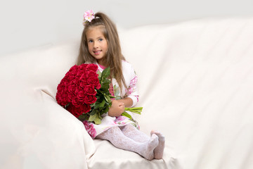 Little girl with a bouquet of flowers