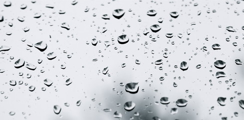 Raindrops on glass.