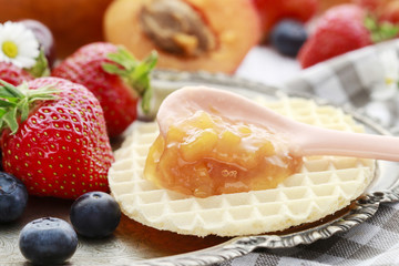 Tasty and healthy breakfast: waffles with fruit jam.