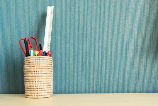 School and office supplies over office table with empty space for text..
