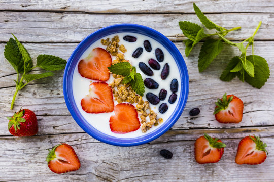 A delicious and healthy breakfast of yogurt with fresh fruit. 