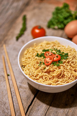 instant noodle in bowl cooked spicy taste topping with eggs