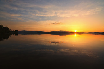 Amazing sunset at the Lipno Dam (Lake). Spring evening. Czech Republic