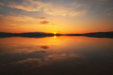 Awesome sunset at the Lipno Dam (Lake). Spring evening. Czech Republic