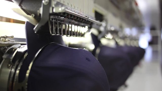 Sports Caps Hats Being Embroidered
