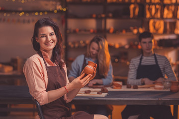 Attractive woman in pottery
