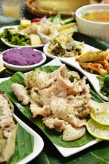 A set menu fried pork with salad, rice and soup .