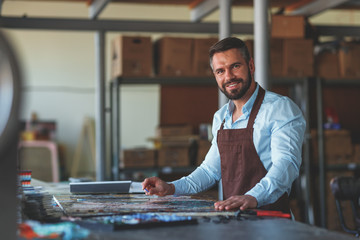 Smiling master in studio