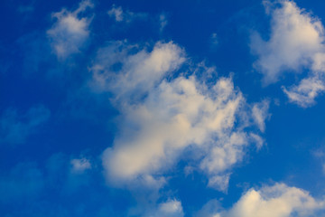Fototapeta na wymiar Clouds on a blue sky as a background