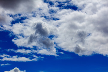 Clouds on a blue sky as a background
