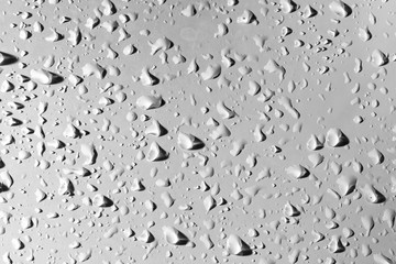 Drops of water with shadow on white background