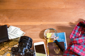 accessories on wooden desk background of photographer, voyage concept,