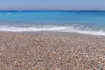 Beauty summer pebble beach turquoise harmony sea with gentle waves