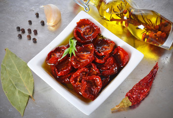 Dried cherry tomatoes ,spices. Italian cuisine.