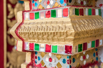 detail of beautiful decorative geometric ornaments with gemstones in Buddhist temple