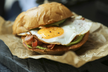 Freshly made burger with fried egg and bacon