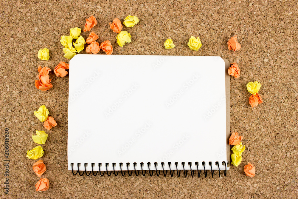 Poster notepad and crumpled paper balls. office concept. empty space for design and text. cork background