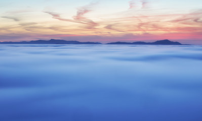 Fototapeta na wymiar Dramatic clouds with mountain silhouette in dawn, Slovakia.