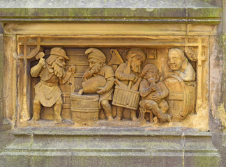 Relief gnomes butchers. Fragment of the Dwarf Fountain in Cologne. The fountain was created in...
