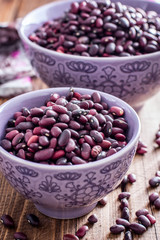 red beans dry in two bowls, selective focus