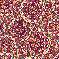 Vector Seamless pattern of circular texture. Mandala is large and small in the background. In boho style for a seamless textile patterns