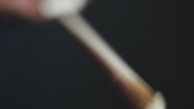 Applying Rosin to a Violin Bow