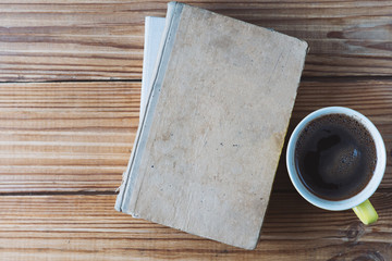 Mug of coffee and old books