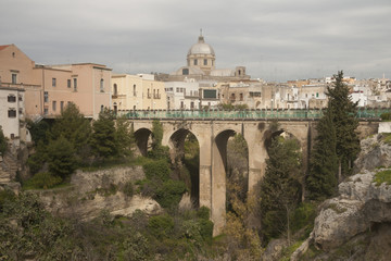 Bridge over he canyon in small beautiful town in South Italy Massafra, region Puglia
