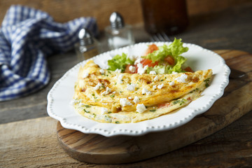 Homemade omelette with herbs and Feta cheese