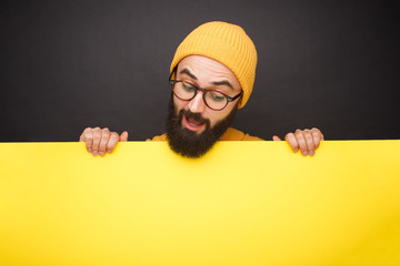 Interested man looking over banner