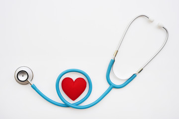 Red heart with stethoscope isolated on white background