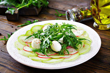 Carpaccio of radish with arugula, mozzarella and  sauce. Healthy food. Daikon salad