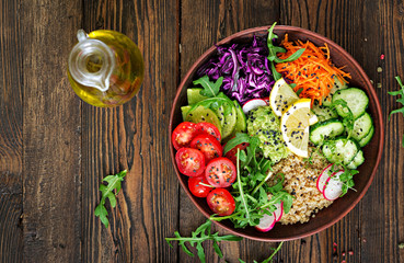 Vegetarian Buddha bowl with quinoa and fresh vegetables. Healthy food concept. Vegan salad. Top...