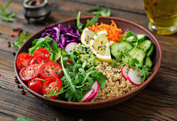 Vegetarian Buddha bowl with quinoa and fresh vegetables. Healthy food concept. Vegan salad.