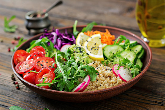 Vegetarian Buddha bowl with quinoa and fresh vegetables. Healthy food concept. Vegan salad.