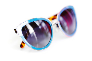Stylish women's sunglasses on white background