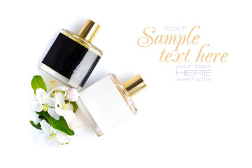 Men's and women's perfume with flowers on a white background, top view