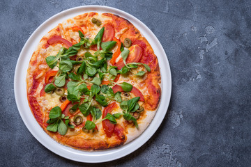 Vegetarian pizza on grey background, copy space