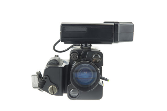 front view of an .amateur video camera of the 80s / isolated on white portrait of a vintage movie camera